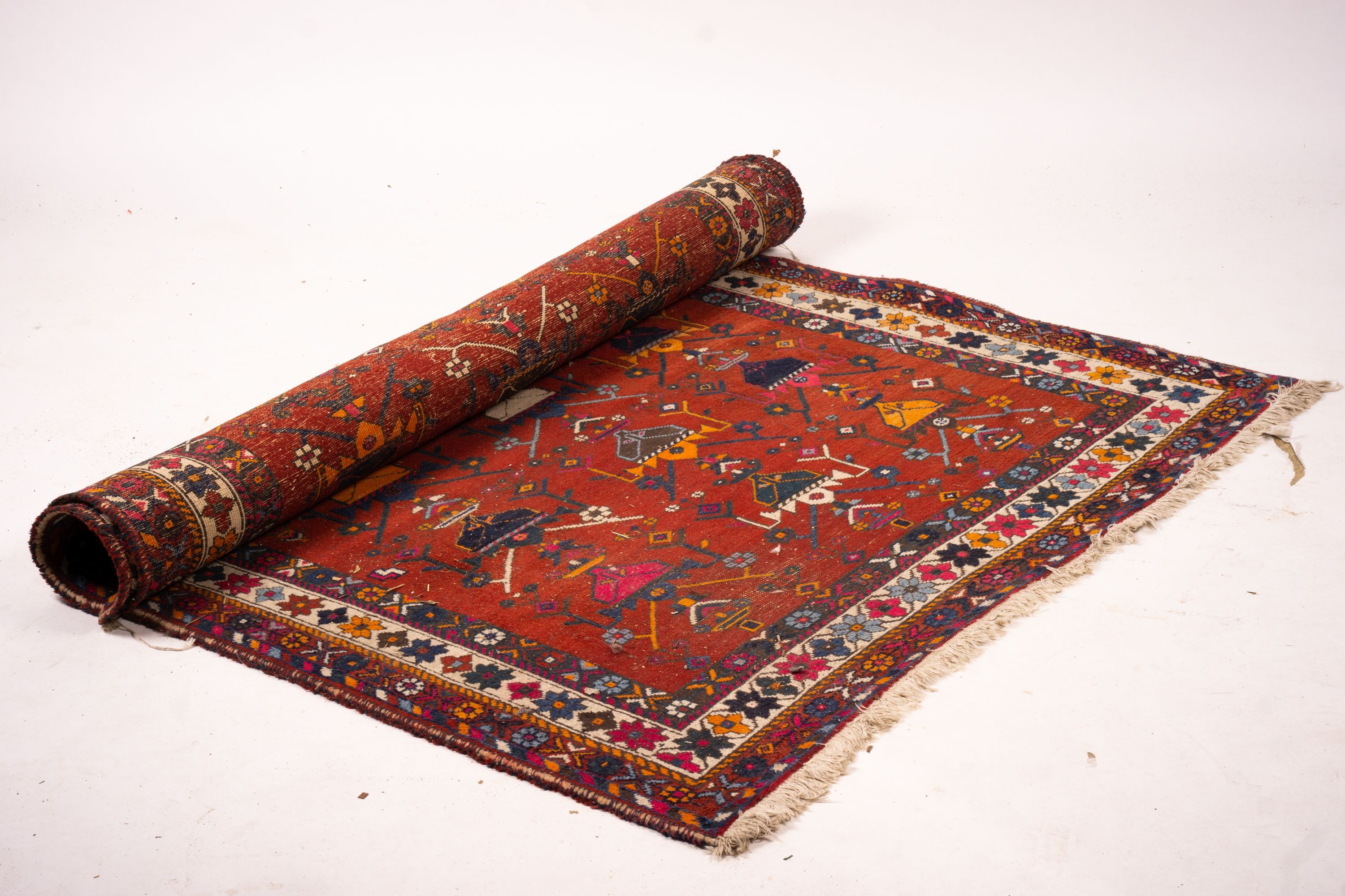 A Turkish red ground rug, 190 x 152cm